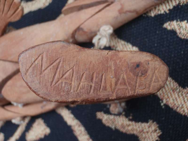African wood carving by well known Bethwell Mahlaba - jointed limbed figure. Signed on each foot.