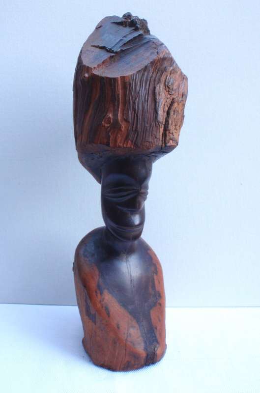 Authenic African wood carving.  Interesting, unique avant-garde dimensions and use of wood.