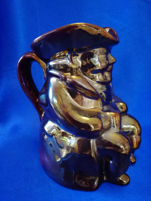 An extremely rare brown bronze luster Toby jug by Roddy ware of Staffordshire England