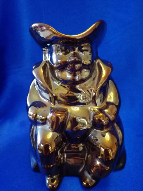 An extremely rare brown bronze luster Toby jug by Roddy ware of Staffordshire England