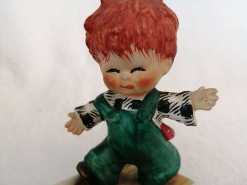 Goebel red head figurine Boy with Ball, Strike