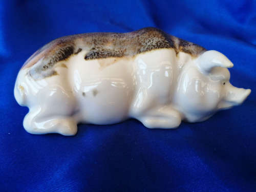 Cream and Brown Porcelain Lying Pig *