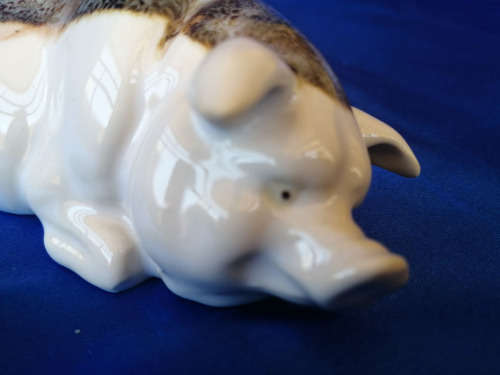 Cream and Brown Porcelain Lying Pig *
