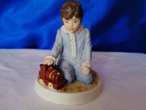 Wedgwood Boy Playing with train Figure
