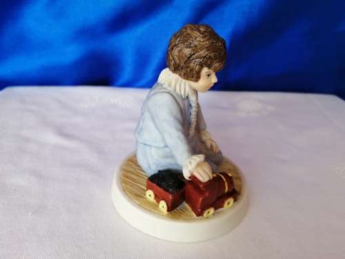 Wedgwood Boy Playing with train Figure