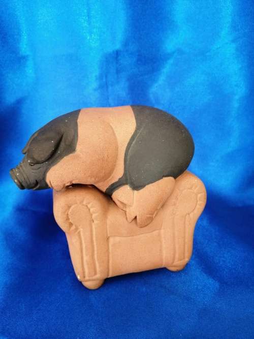 Vintage Large Pottery Pig Sleeping on a Chair