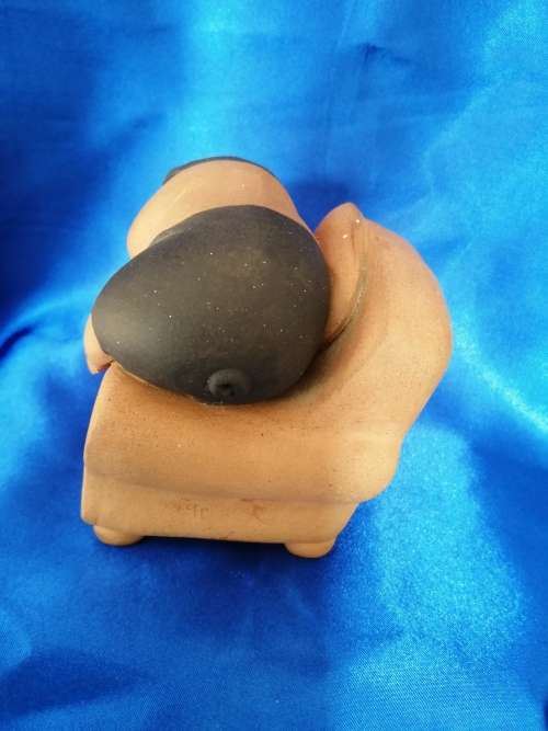 Vintage Large Pottery Pig Sleeping on a Chair
