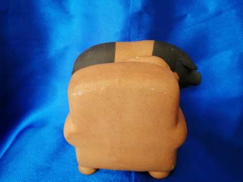 Vintage Large Pottery Pig Sleeping on a Chair