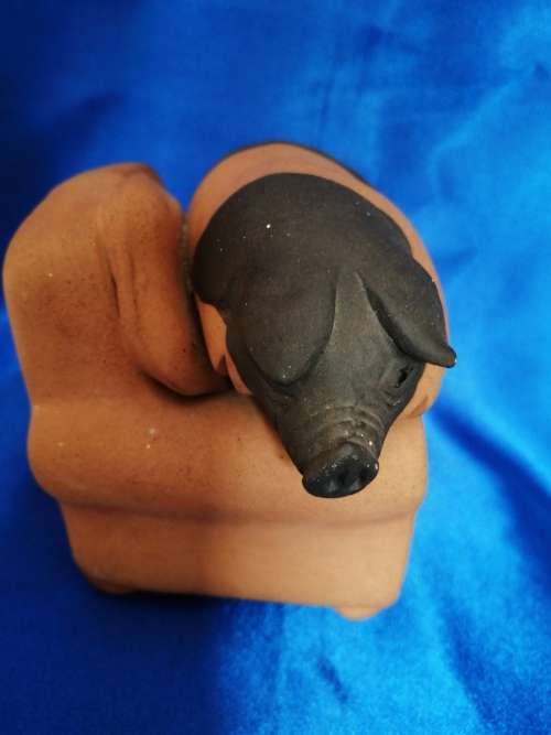 Vintage Large Pottery Pig Sleeping on a Chair
