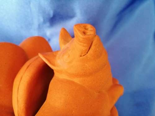 Vintage Large Pottery Pig Sleeping on a Chair
