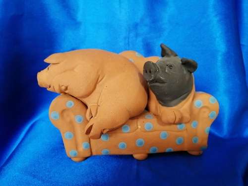 Vintage Large Pottery Pigs Sleeping on a Chair