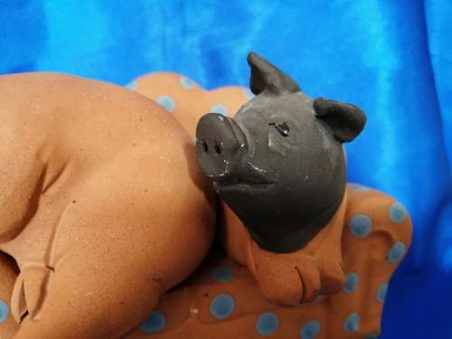 Vintage Large Pottery Pigs Sleeping on a Chair