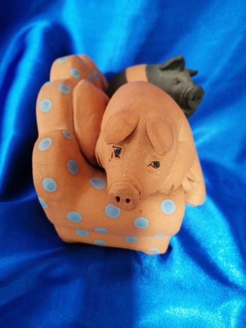 Vintage Large Pottery Pigs Sleeping on a Chair