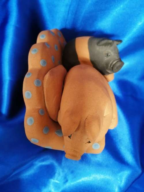 Vintage Large Pottery Pigs Sleeping on a Chair