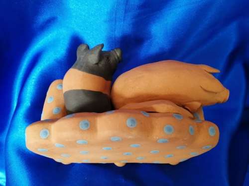 Vintage Large Pottery Pigs Sleeping on a Chair