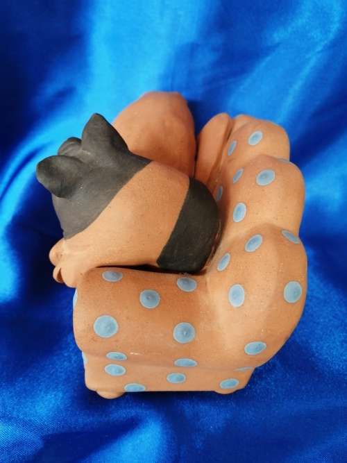 Vintage Large Pottery Pigs Sleeping on a Chair