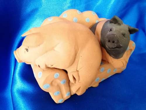 Vintage Large Pottery Pigs Sleeping on a Chair