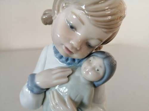 Nao by Lladro figurine, `Girl with Pigtails and Baby Doll` #5102