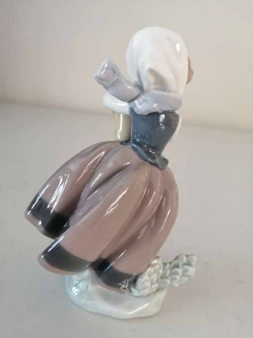 Lladro Figurine Girl Holding Basket of Flowers