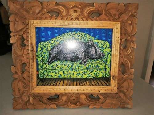 Carved wooden framed print pig sleeping on the sofa #