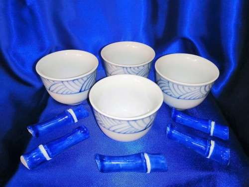 Four Blue and White Chinese Bowls and Five Chopstick Rests