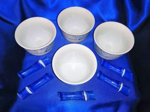 Four Blue and White Chinese Bowls and Five Chopstick Rests