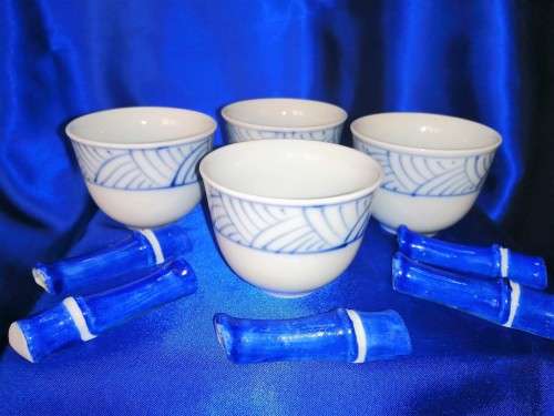 Four Blue and White Chinese Bowls and Five Chopstick Rests