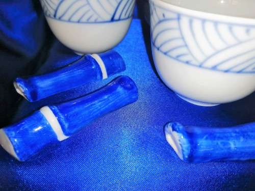 Four Blue and White Chinese Bowls and Five Chopstick Rests