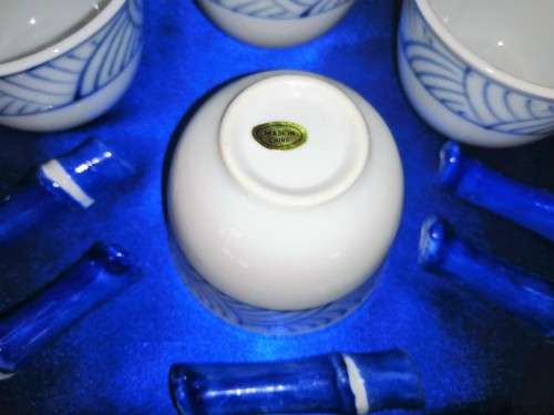 Four Blue and White Chinese Bowls and Five Chopstick Rests