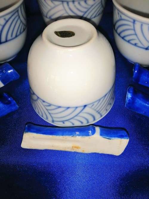 Four Blue and White Chinese Bowls and Five Chopstick Rests