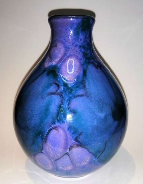 A stunning blend of blue, indigo and violet glazes, this eye-catching Vase by Poole