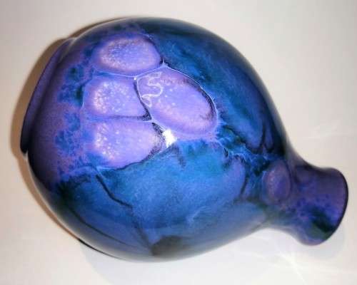 A stunning blend of blue, indigo and violet glazes, this eye-catching Vase by Poole
