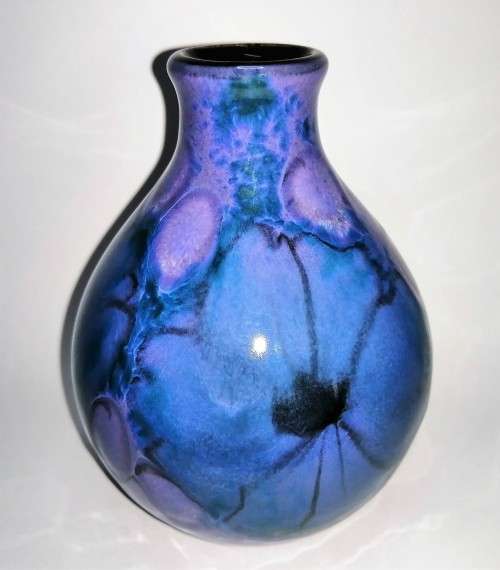 A stunning blend of blue, indigo and violet glazes, this eye-catching Vase by Poole