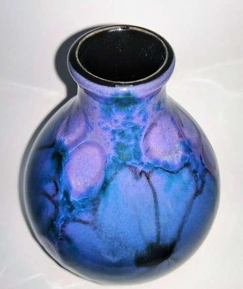 A stunning blend of blue, indigo and violet glazes, this eye-catching Vase by Poole