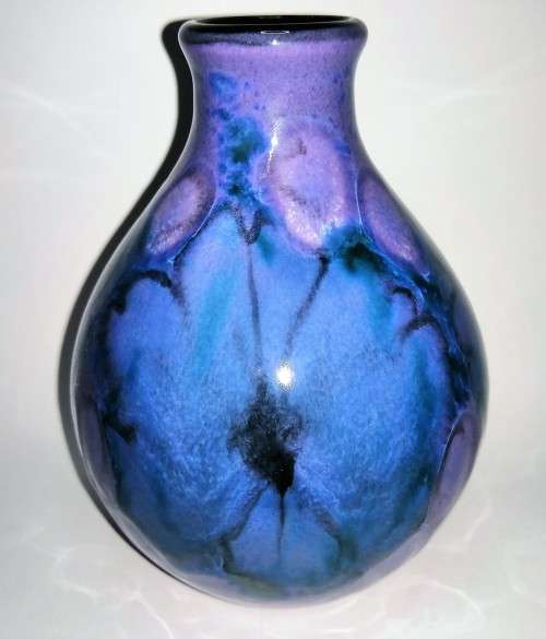 A stunning blend of blue, indigo and violet glazes, this eye-catching Vase by Poole