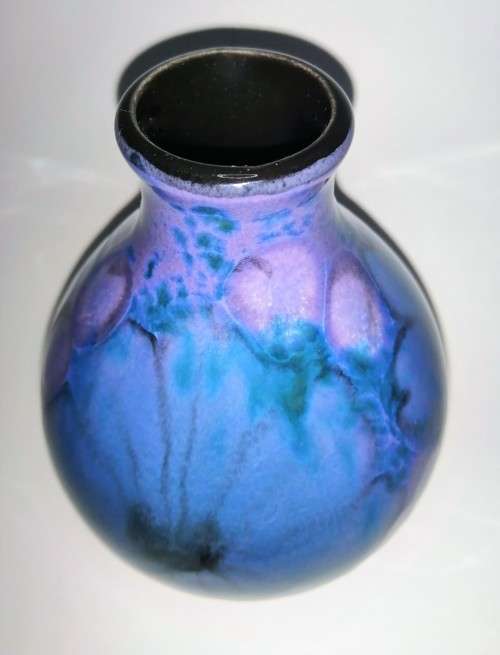A stunning blend of blue, indigo and violet glazes, this eye-catching Vase by Poole