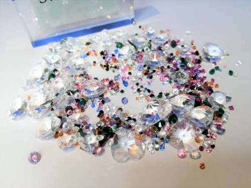 Offer SWAROVSKI Crystal Large amount of crystals and hearts.To use around your display + two others#