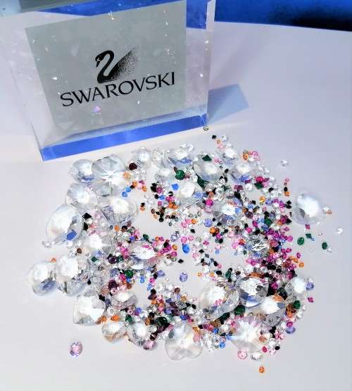 Offer SWAROVSKI Crystal Large amount of crystals and hearts.To use around your display + two others#