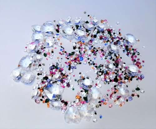 Offer SWAROVSKI Crystal Large amount of crystals and hearts.To use around your display + two others#