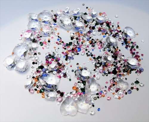 Offer SWAROVSKI Crystal Large amount of crystals and hearts.To use around your display + two others#