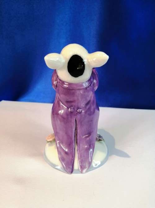 Old Porcelain Pig Playing the Flute