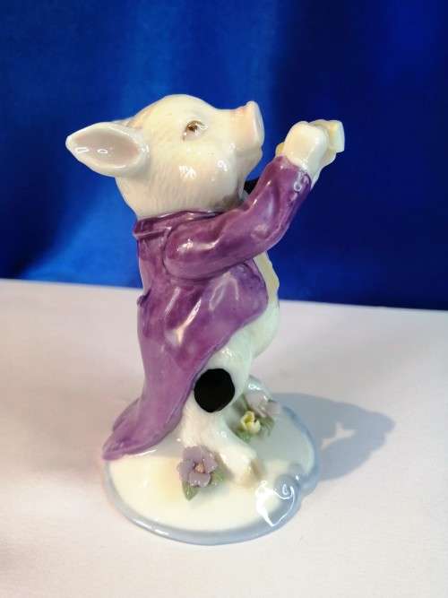 Old Porcelain Pig Playing the Flute