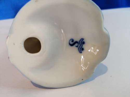 Old Porcelain Pig Playing the Flute
