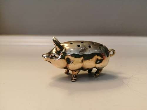 Pin cushion. A small brass pig with holes to insert your pins. English cir 1870.