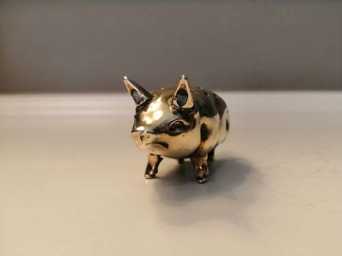 Pin cushion. A small brass pig with holes to insert your pins. English cir 1870.