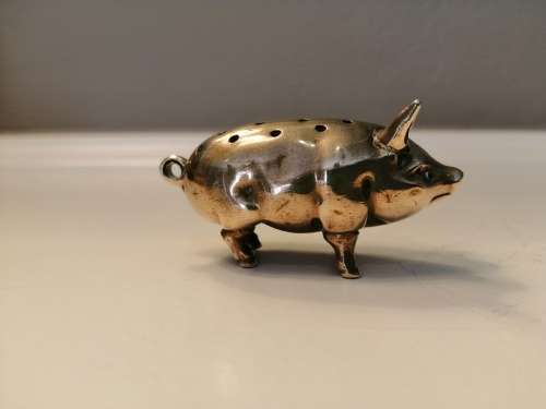 Pin cushion. A small brass pig with holes to insert your pins. English cir 1870.