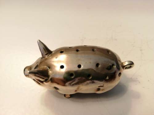 Pin cushion. A small brass pig with holes to insert your pins. English cir 1870.