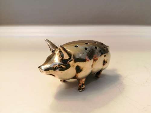 Pin cushion. A small brass pig with holes to insert your pins. English cir 1870.