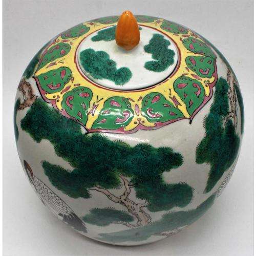 Chinese Famille Rose jar and cover decorated with storks amongst pine trees