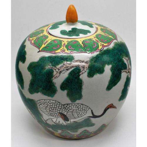 Chinese Famille Rose jar and cover decorated with storks amongst pine trees